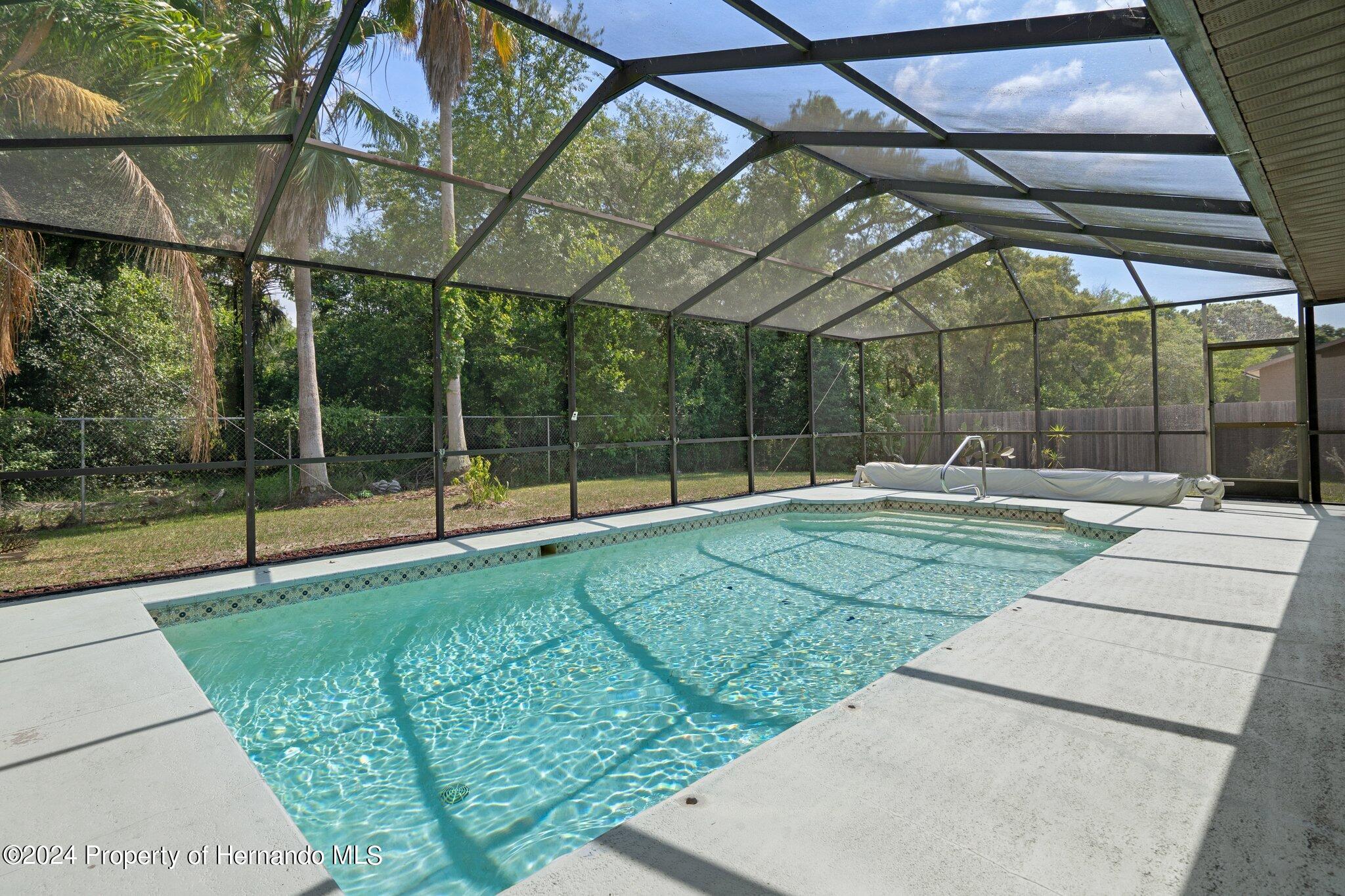 9290 Eldridge Road Spring Hill, FL 34608 - Photo 50 of 55 a view of a park with a small cabin
