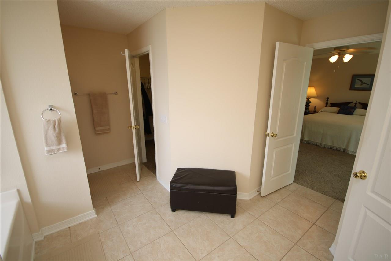 4916 Pineview Ridge Road Pace, FL 32571 - Photo 39 of 50 L-shaped walk-in closet & 18" tile flooring.