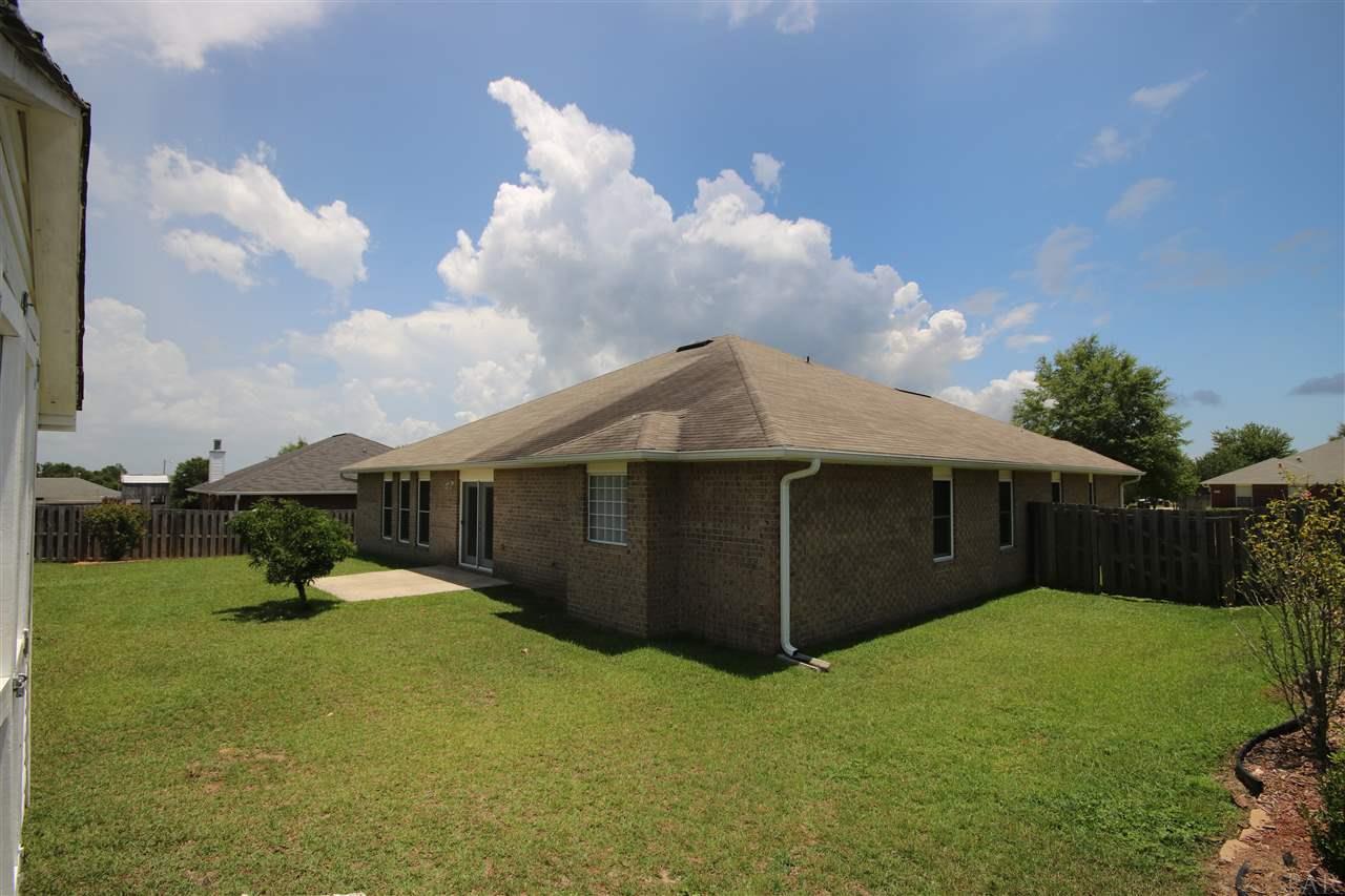 4916 Pineview Ridge Road Pace, FL 32571 - Photo 44 of 50 walk gate on each side of the home.
