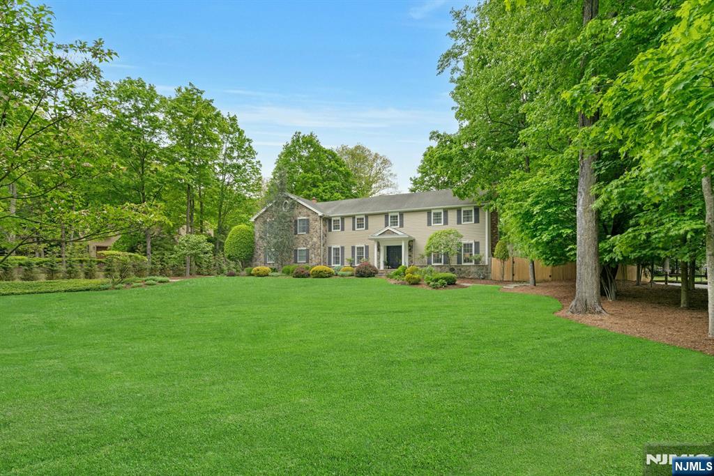 48 Hopper Farm Road Upper Saddle River, NJ 07458 - Photo 40 of 43 a view of a house with a big yard and garden