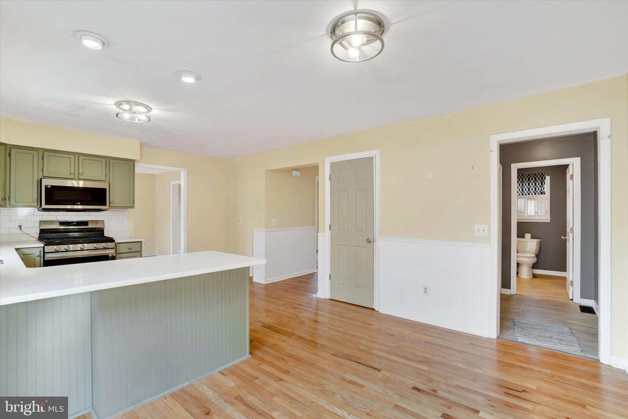 3 Harrison Road New Freedom, PA 17349 - Photo 11 of 28 a kitchen with granite countertop a stove and a refrigerator