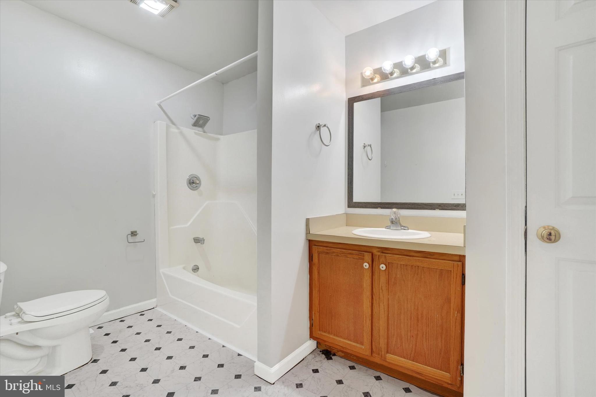 3 Harrison Road New Freedom, PA 17349 - Photo 14 of 28 a bathroom with a sink a toilet and shower
