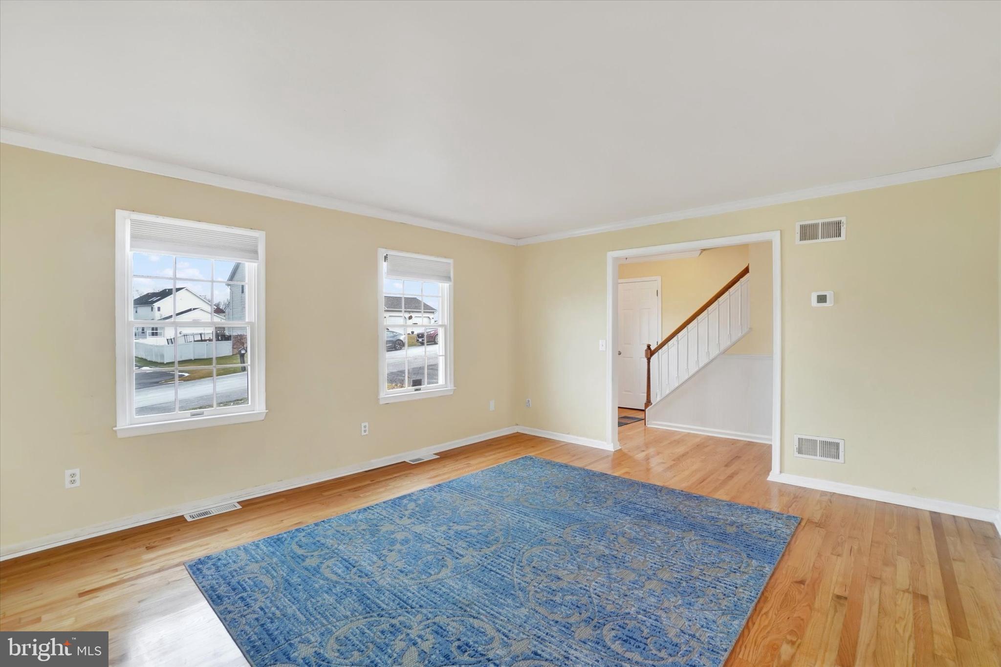 3 Harrison Road New Freedom, PA 17349 - Photo 4 of 28 an empty room with wooden floor and windows