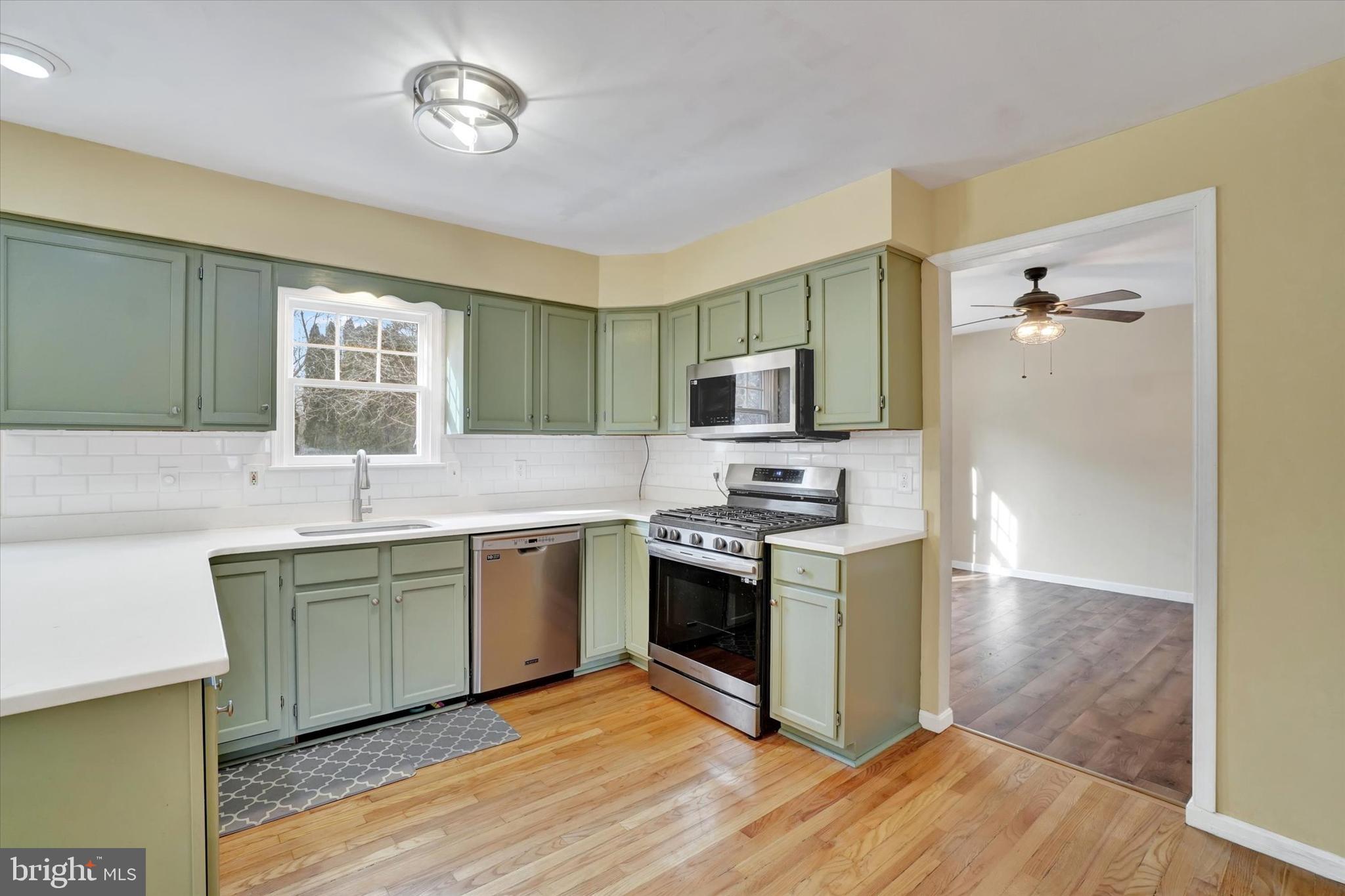 3 Harrison Road New Freedom, PA 17349 - Photo 8 of 28 a kitchen with stainless steel appliances granite countertop a stove top oven a sink dishwasher and a refrigerator