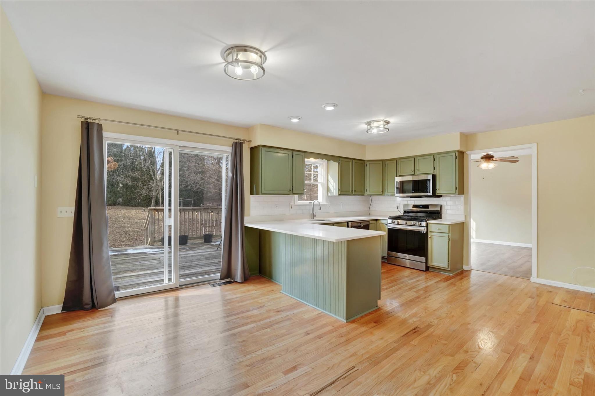 3 Harrison Road New Freedom, PA 17349 - Photo 10 of 28 a large kitchen with kitchen island a counter top space a refrigerator and a sink