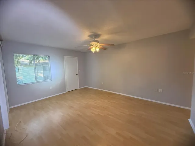 an empty room with a empty space and a window