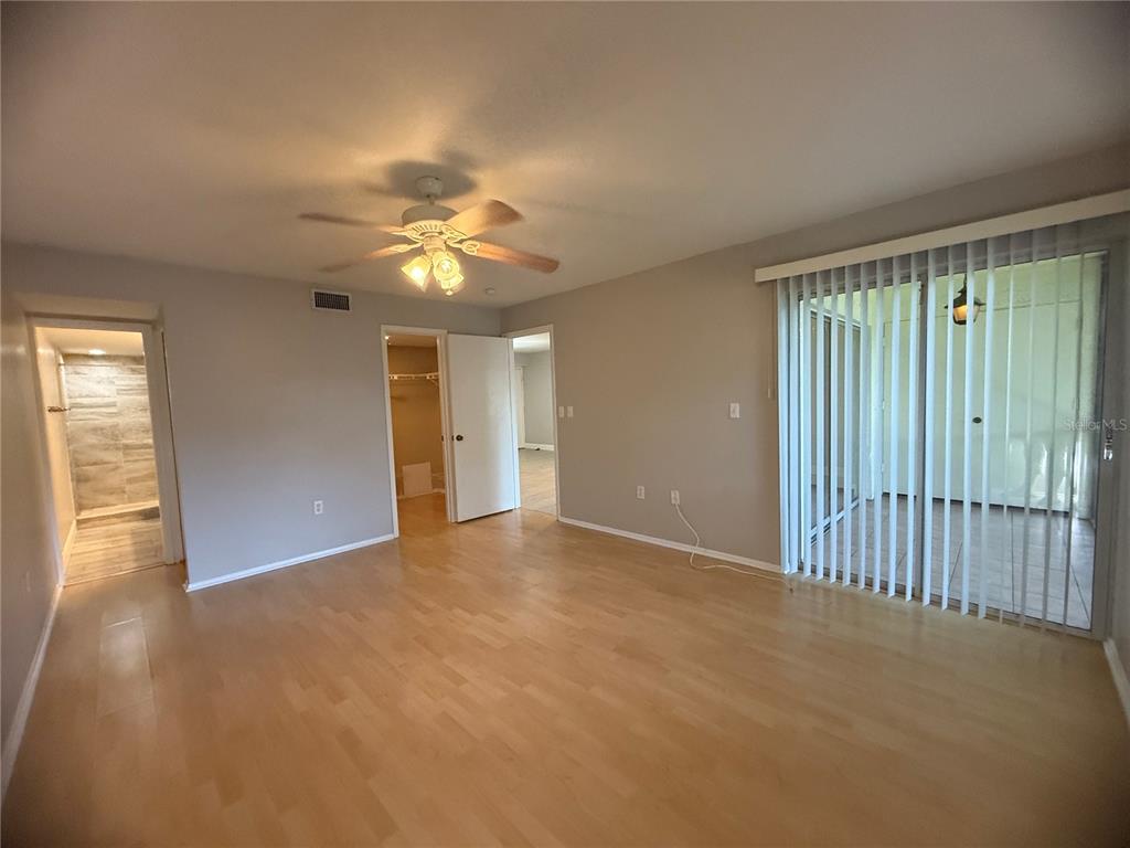 208 Palmetto Court, Unit 208 Oldsmar, FL 34677 - Photo 13 of 48 an empty room with fan and windows