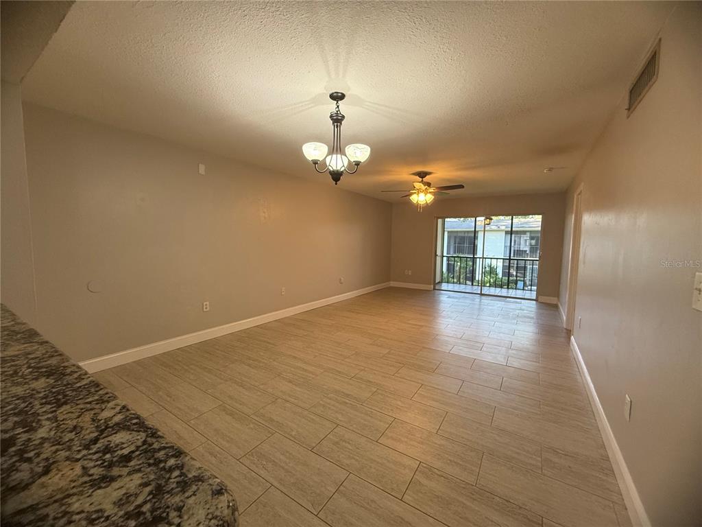 208 Palmetto Court, Unit 208 Oldsmar, FL 34677 - Photo 34 of 48 wooden floor in an empty room with a window