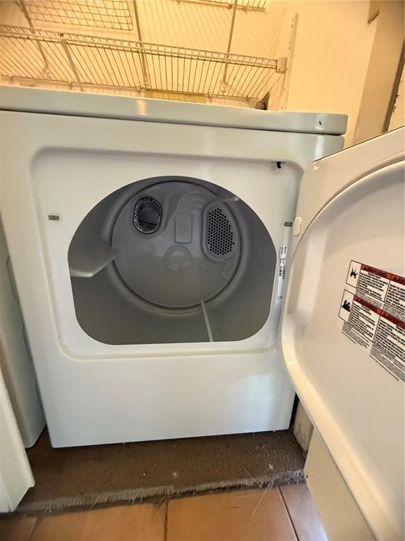 208 Palmetto Court, Unit 208 Oldsmar, FL 34677 - Photo 36 of 48 a utility room with dryer and washer