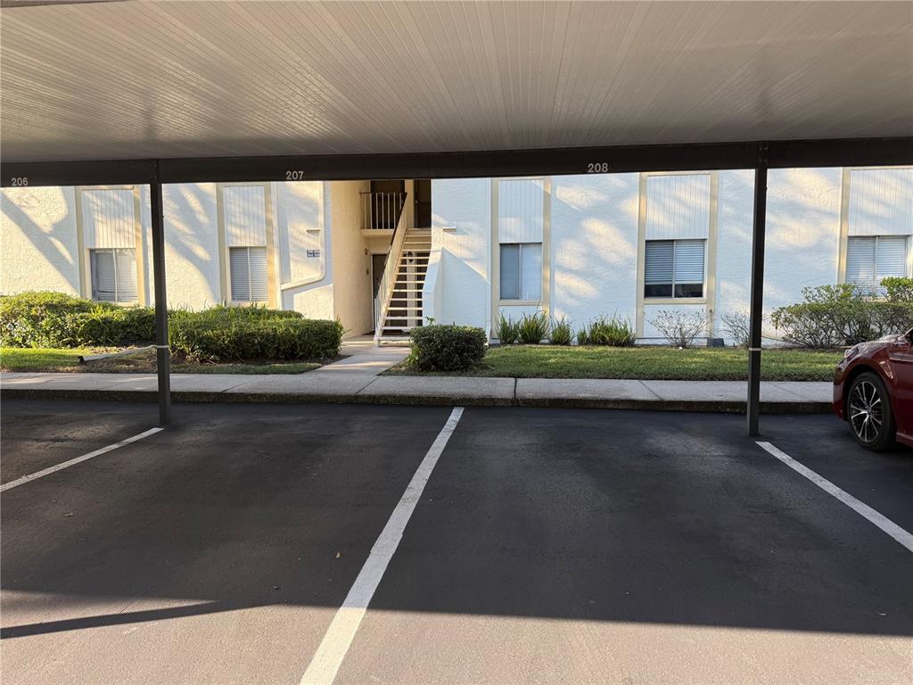 208 Palmetto Court, Unit 208 Oldsmar, FL 34677 - Photo 48 of 48 a view of a building with car parked