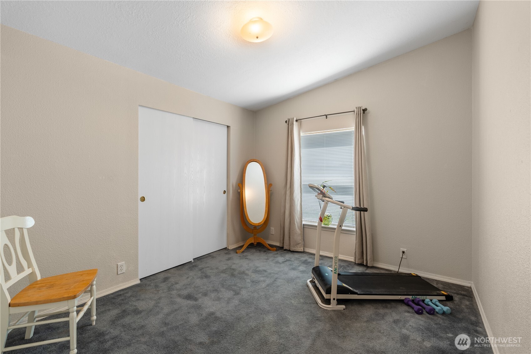 16742 Sheldon Lane Southwest Rochester, WA 98579 - Photo 20 of 40 a room with a chair and a window