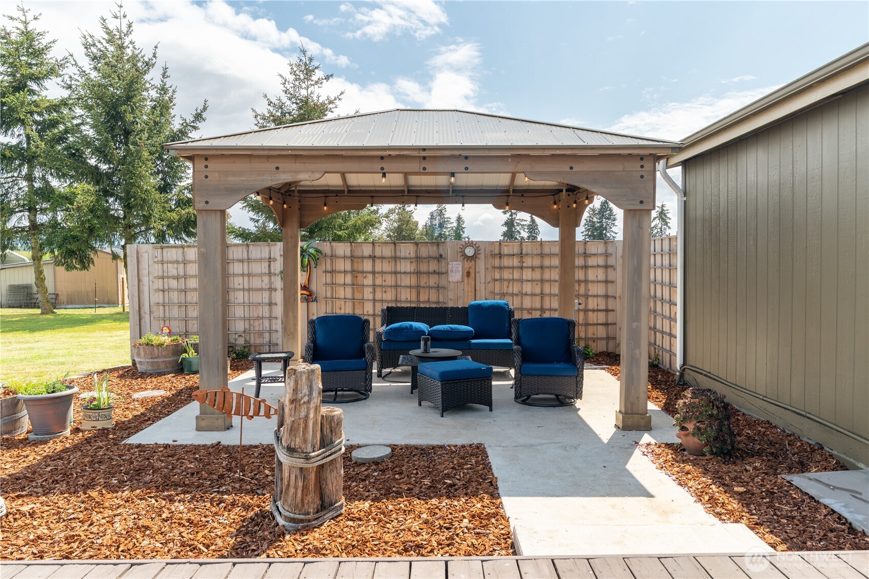16742 Sheldon Lane Southwest Rochester, WA 98579 - Photo 23 of 40 a outdoor living space with furniture and a rug