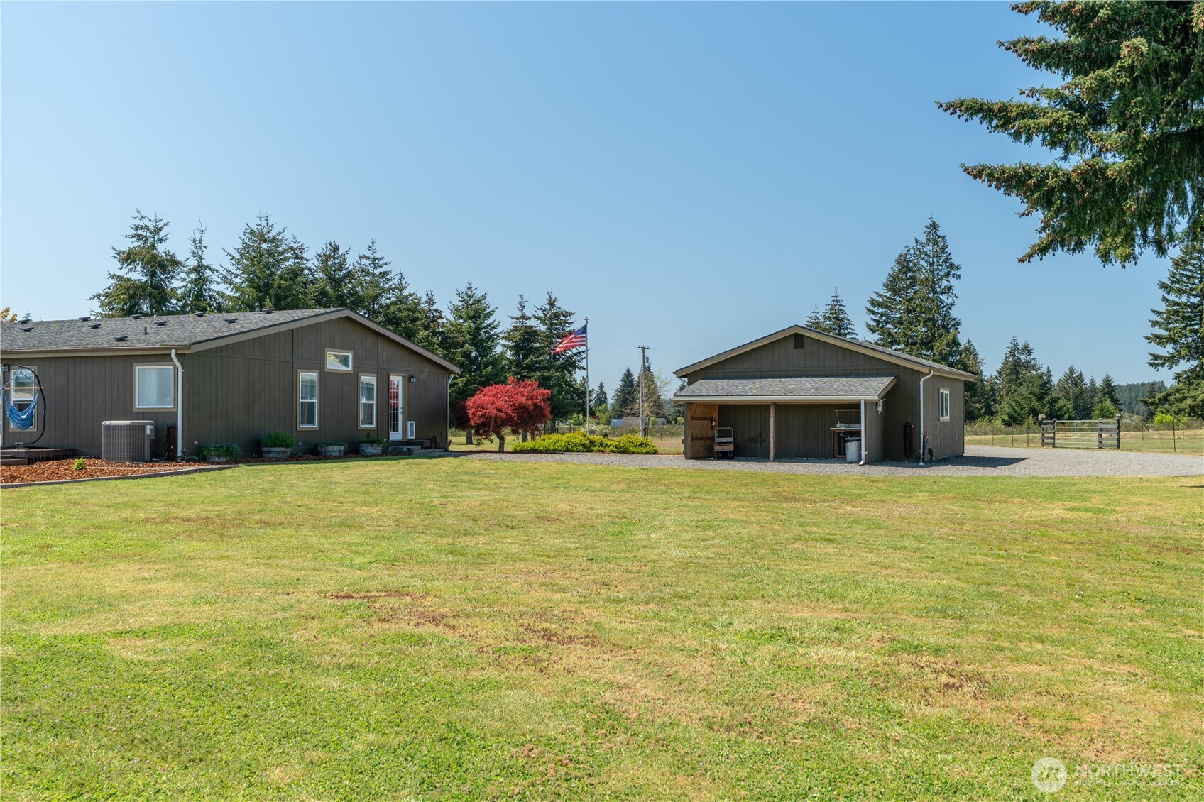 16742 Sheldon Lane Southwest Rochester, WA 98579 - Photo 26 of 40 a front view of house with an outdoor space and seating
