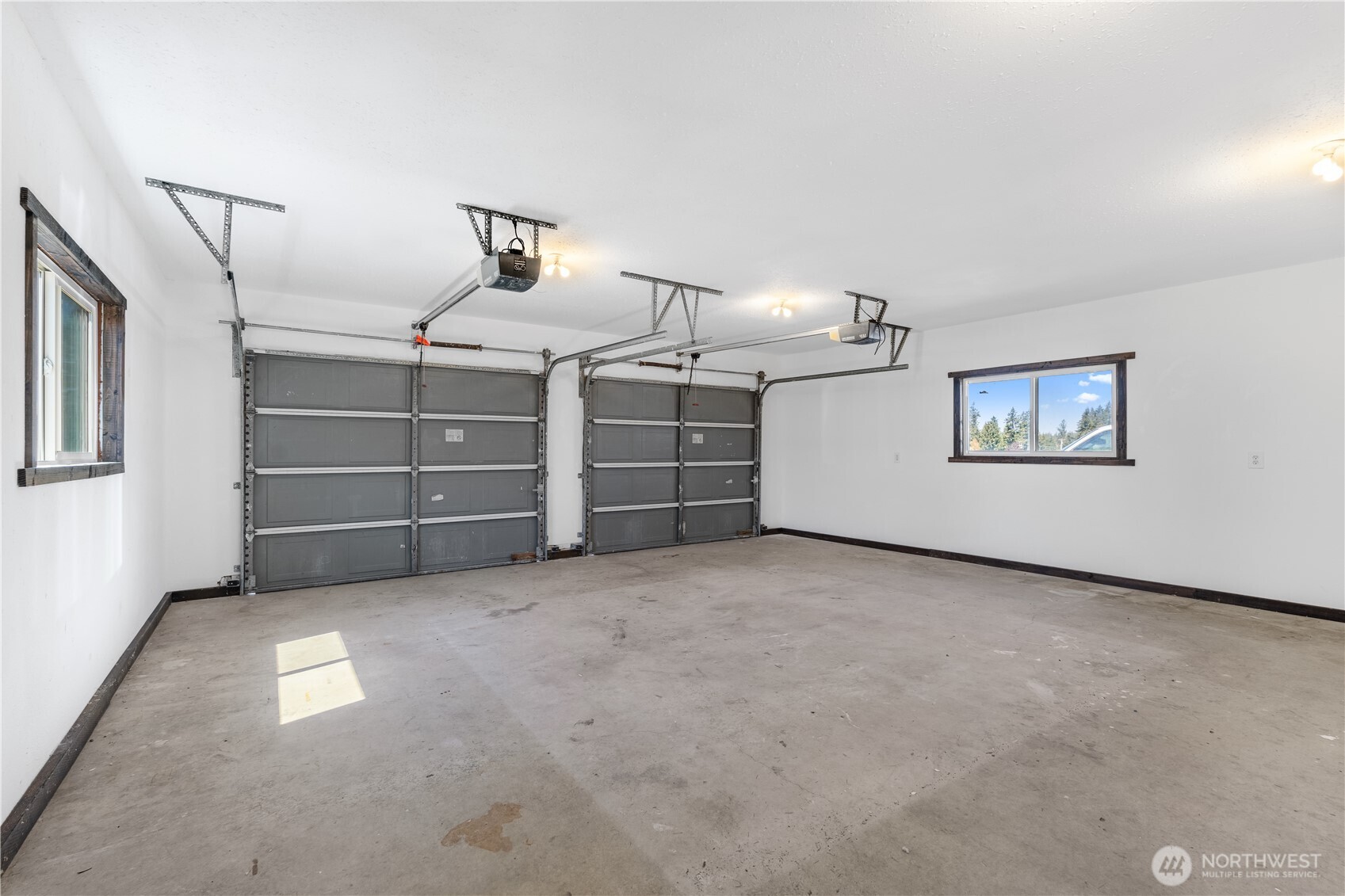 16742 Sheldon Lane Southwest Rochester, WA 98579 - Photo 27 of 40 a view of a garage room and a window