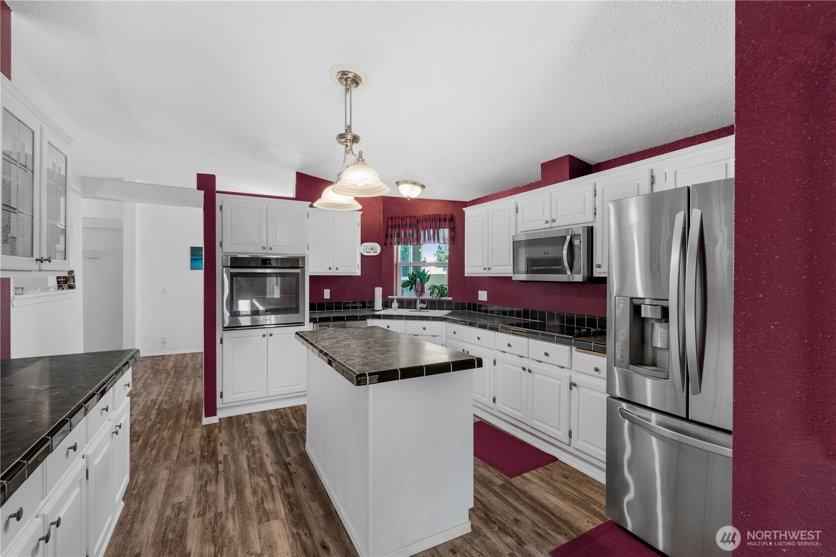 16742 Sheldon Lane Southwest Rochester, WA 98579 - Photo 4 of 40 a kitchen with stainless steel appliances granite countertop a sink refrigerator and microwave
