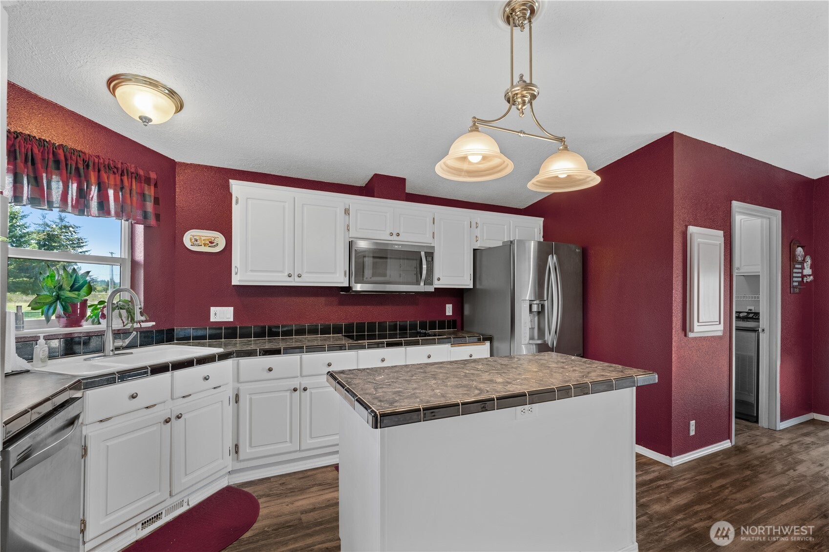 16742 Sheldon Lane Southwest Rochester, WA 98579 - Photo 5 of 40 a kitchen with stainless steel appliances granite countertop a sink and cabinets