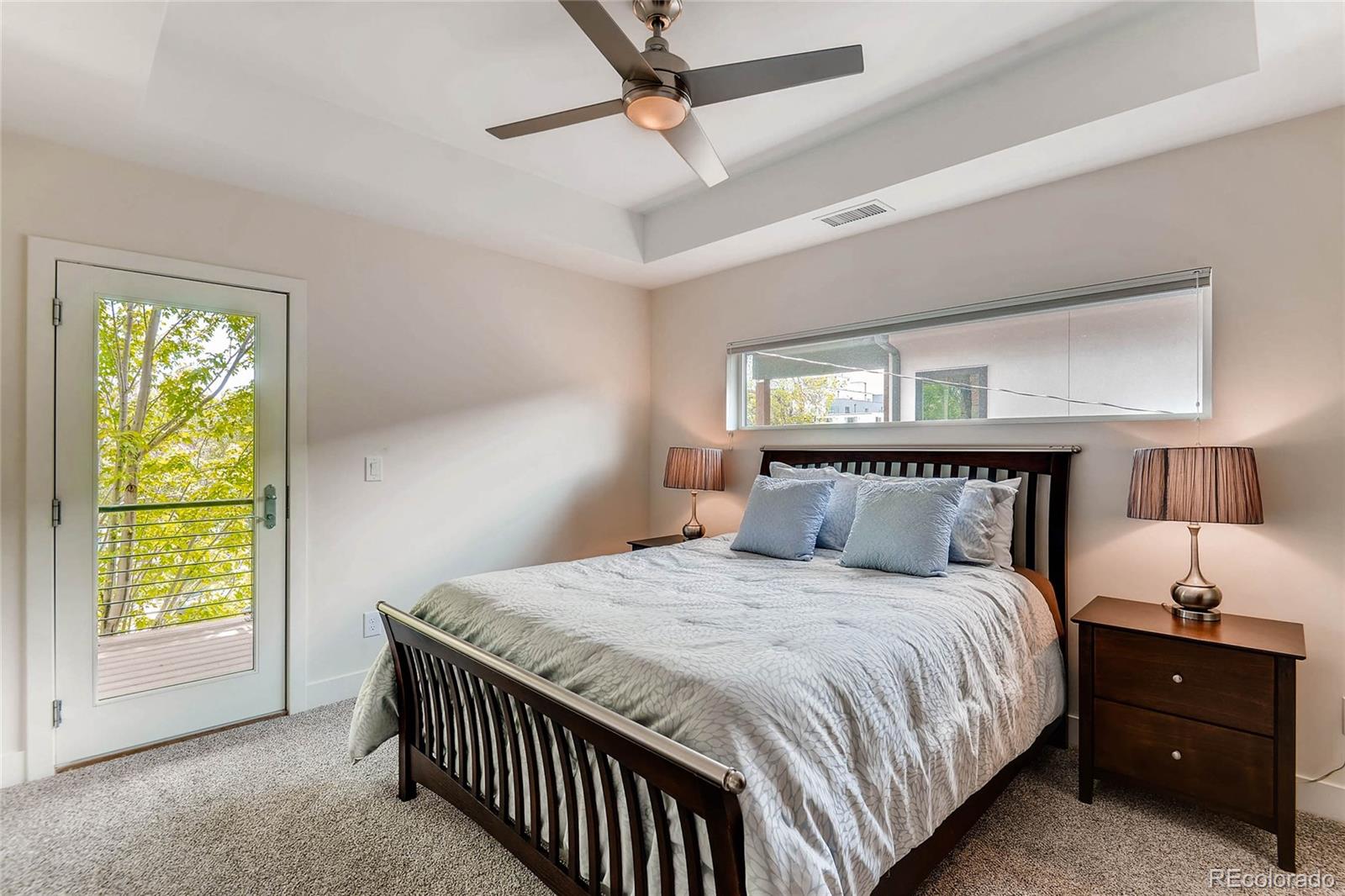 3957 Utica Street Denver, CO 80212 - Photo 13 of 28 a bedroom with a bed and a night stand