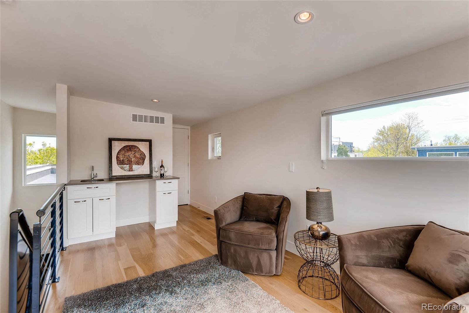 3957 Utica Street Denver, CO 80212 - Photo 17 of 28 a living room with furniture and a window