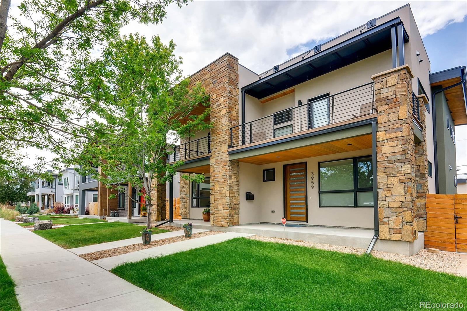 3957 Utica Street Denver, CO 80212 - Photo 2 of 28 front view of a house with a yard