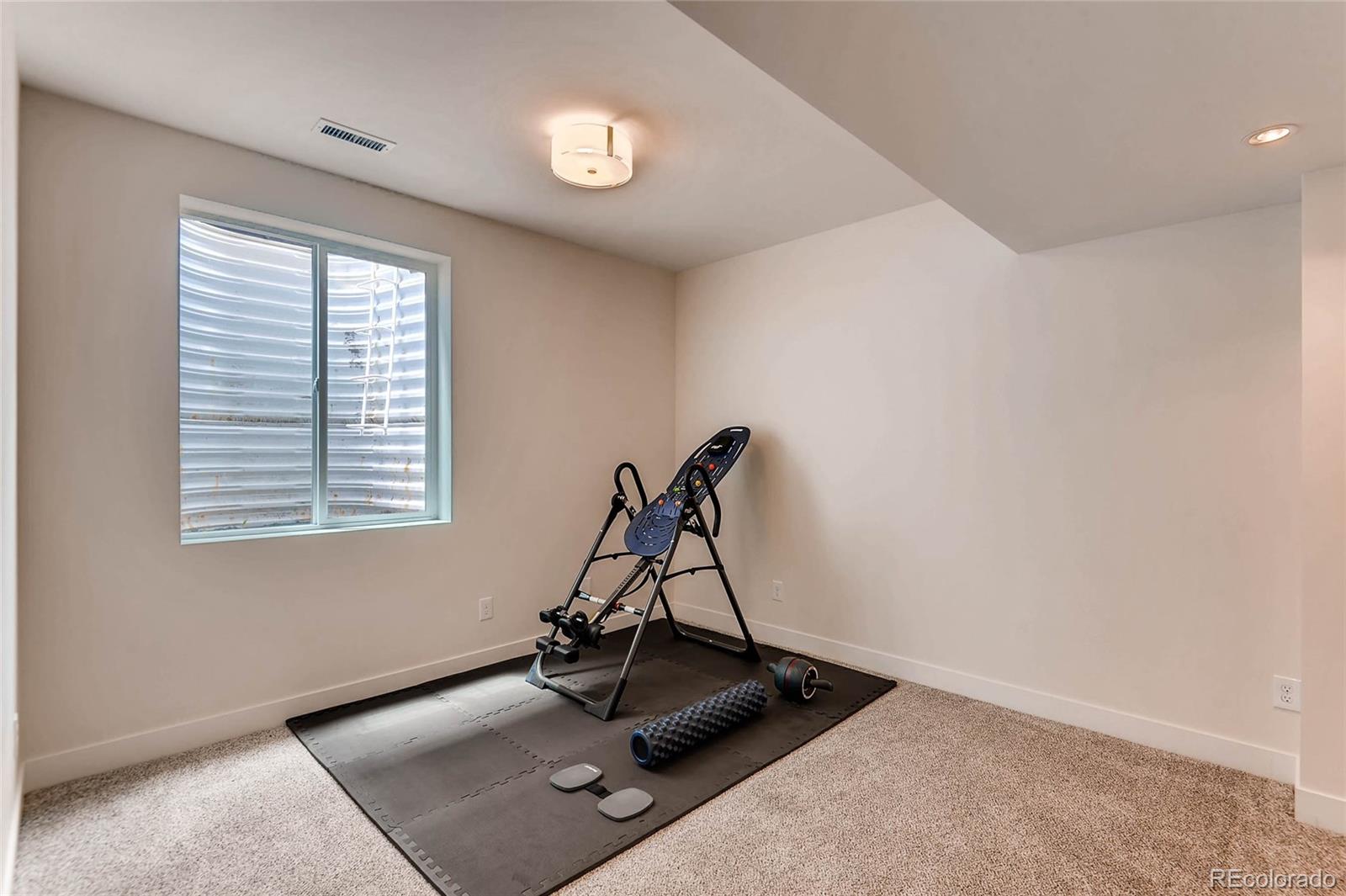 3957 Utica Street Denver, CO 80212 - Photo 21 of 28 a view of a room with gym equipment