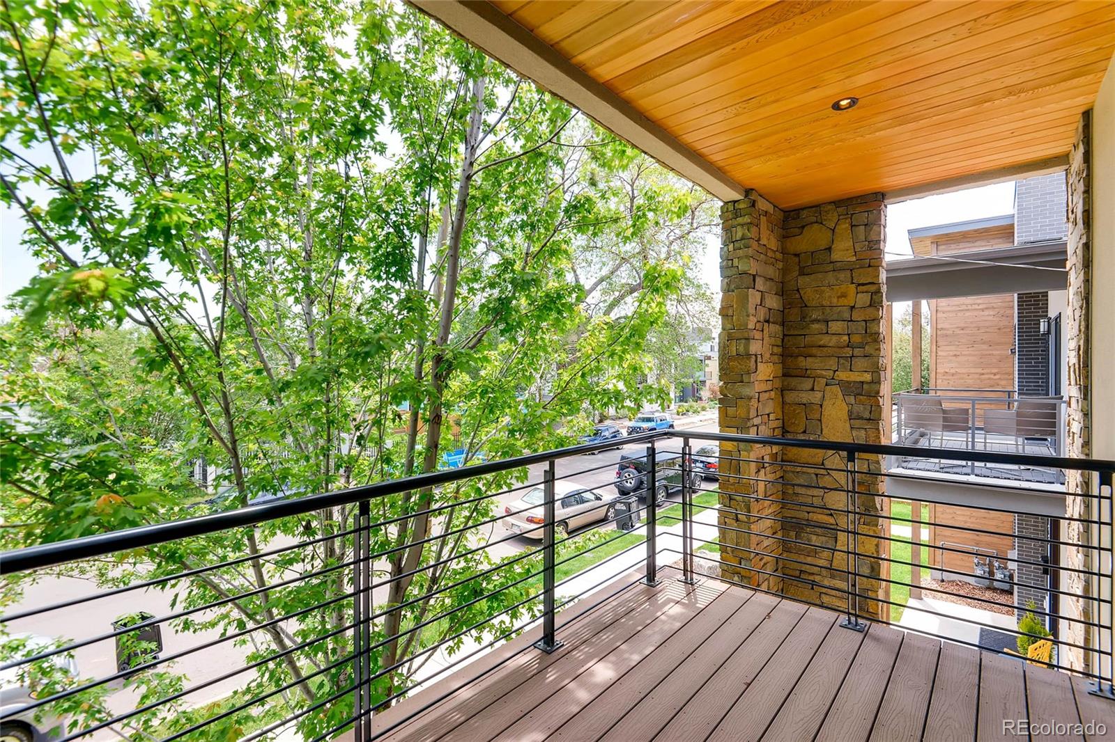 3957 Utica Street Denver, CO 80212 - Photo 23 of 28 a view of balcony with wooden floor