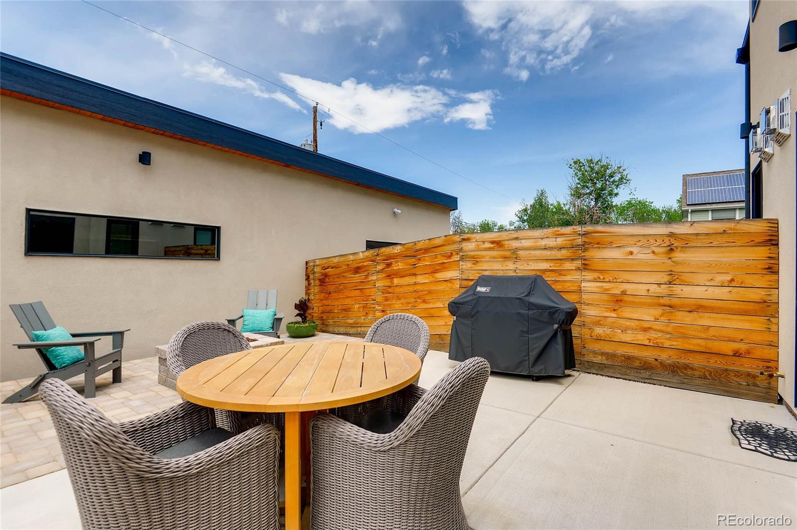 3957 Utica Street Denver, CO 80212 - Photo 24 of 28 a balcony with table and chairs