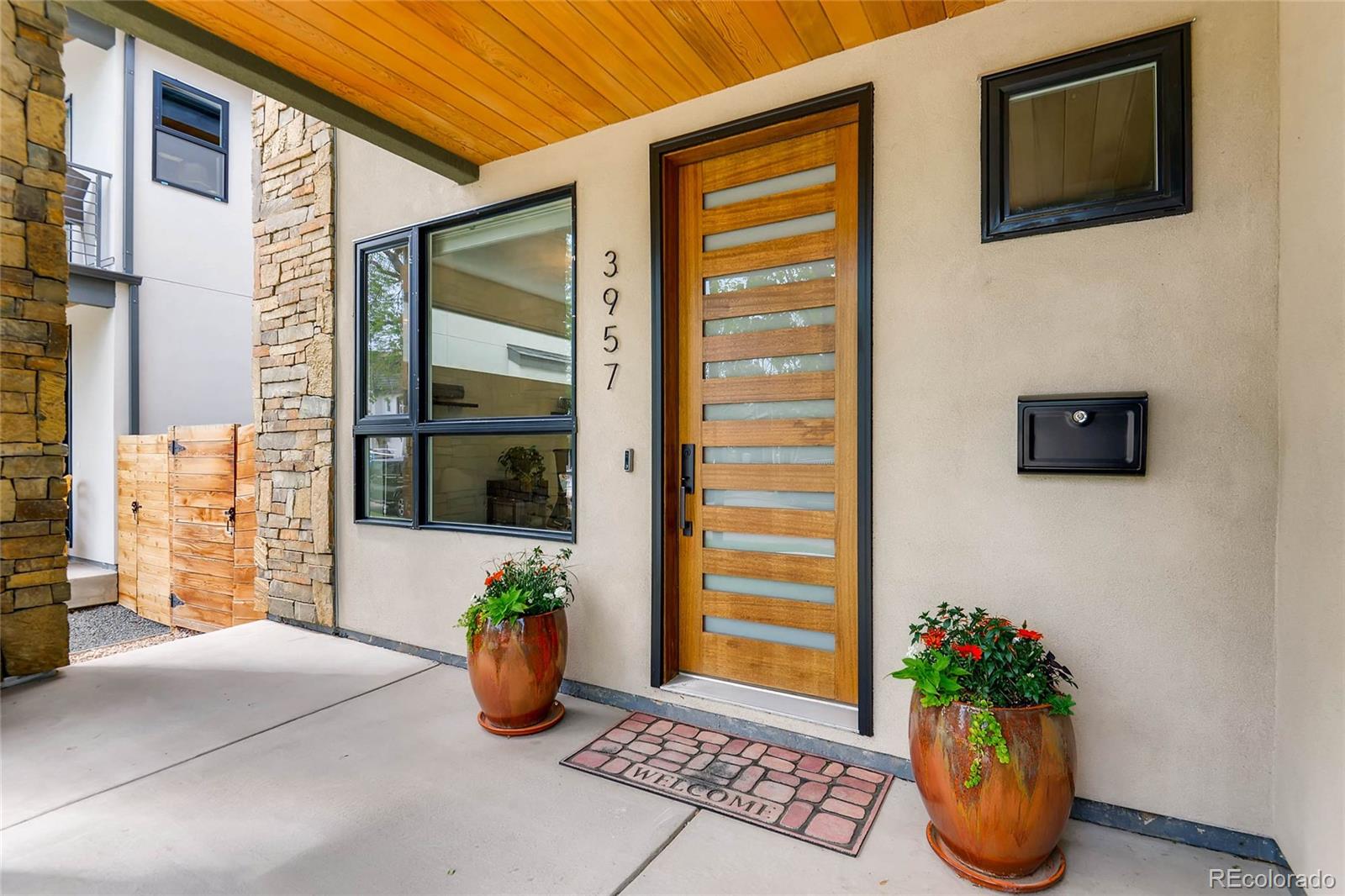 3957 Utica Street Denver, CO 80212 - Photo 3 of 28 a view of a entryway door front of house