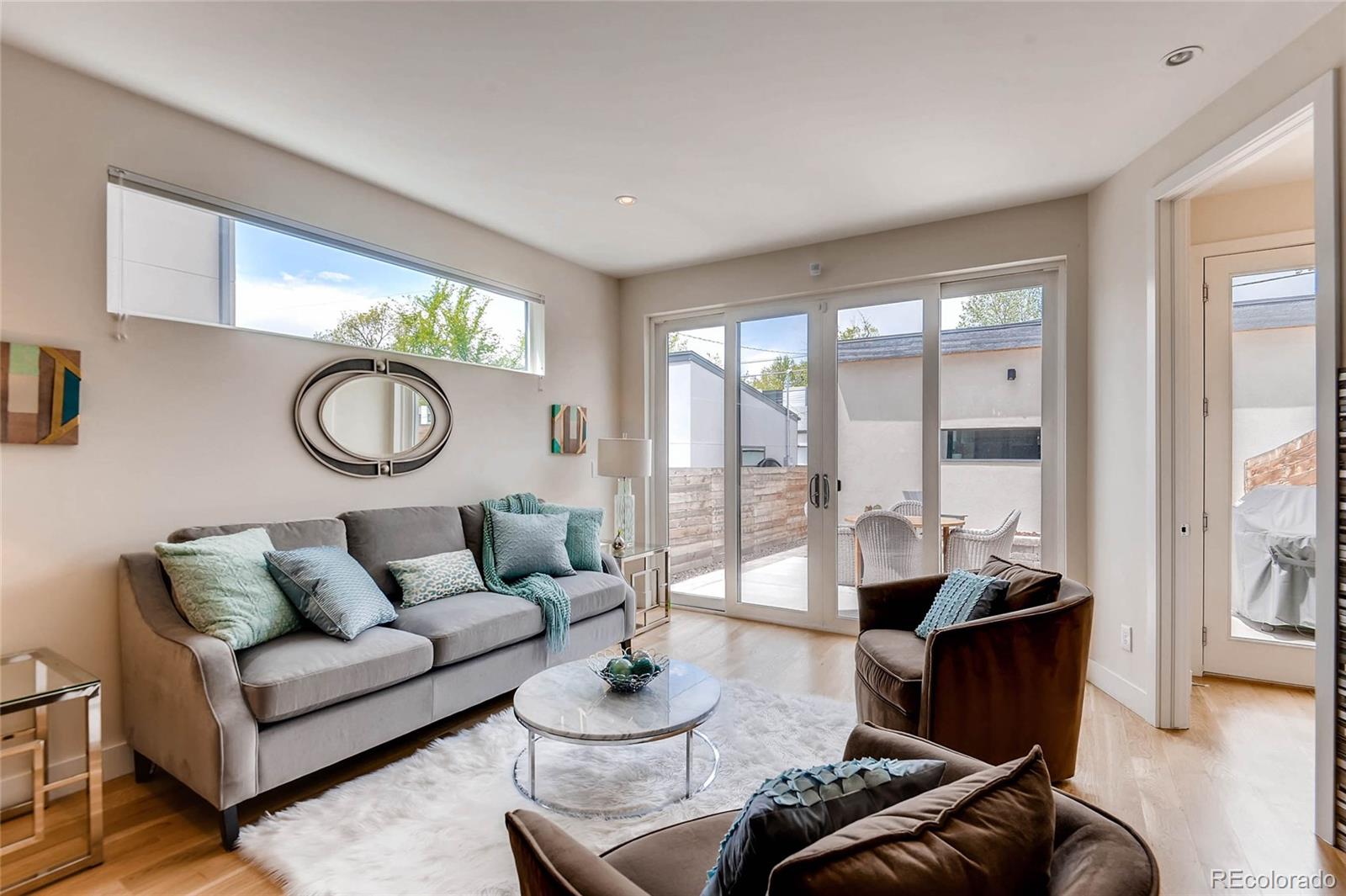 3957 Utica Street Denver, CO 80212 - Photo 5 of 28 a living room with furniture and a large window