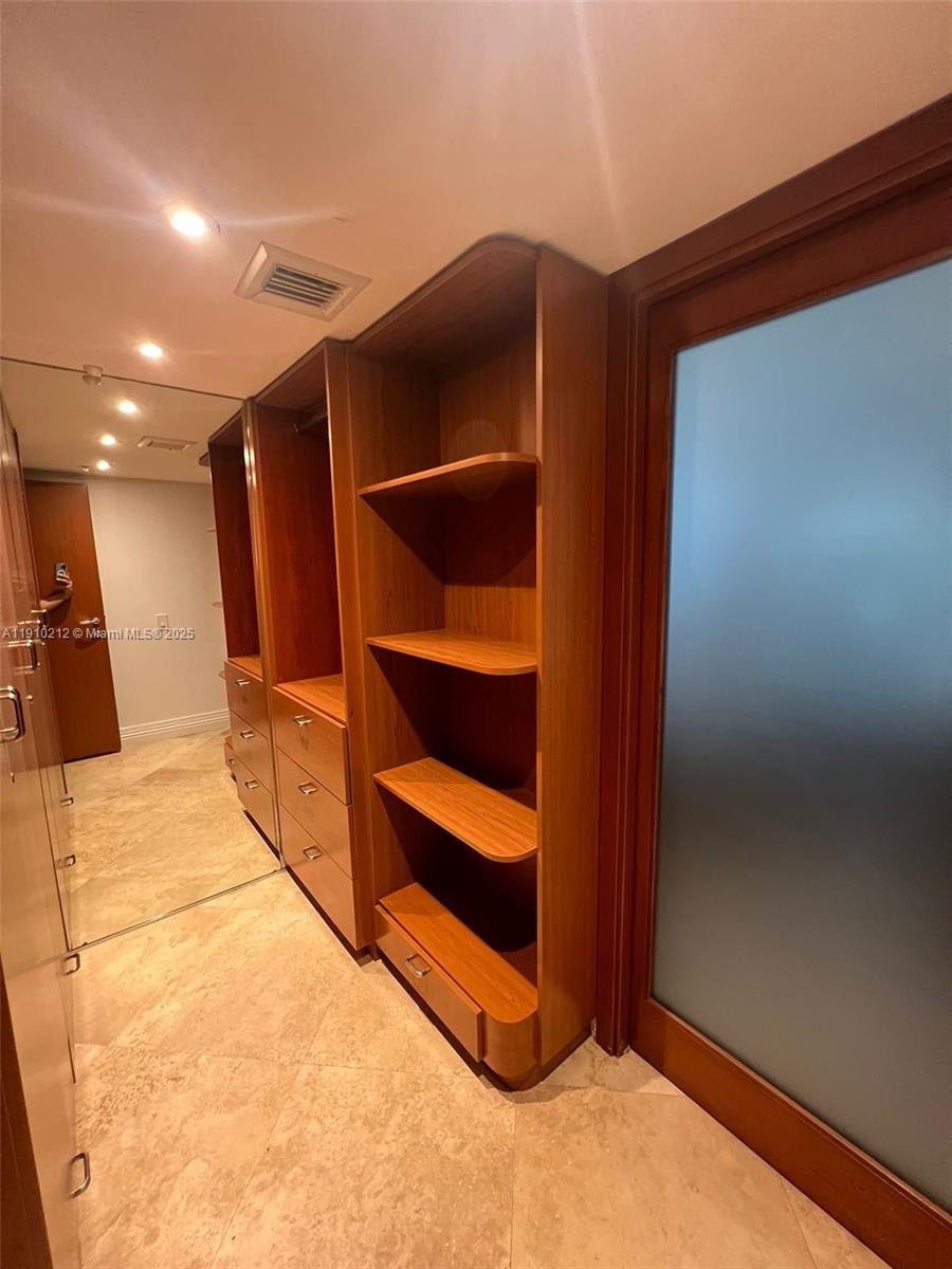 9499 Collins Avenue, Unit 308 Surfside, FL 33154 - Photo 3 of 8 a view of room with wooden floor