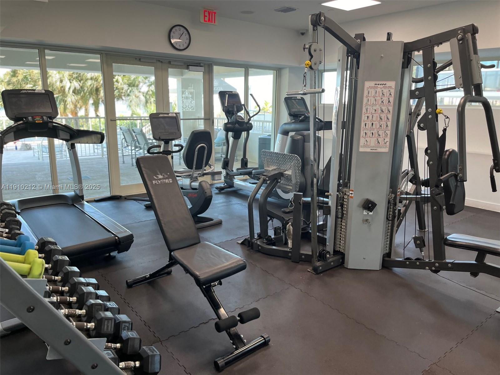9499 Collins Avenue, Unit 308 Surfside, FL 33154 - Photo 4 of 8 a view of a room with gym equipment