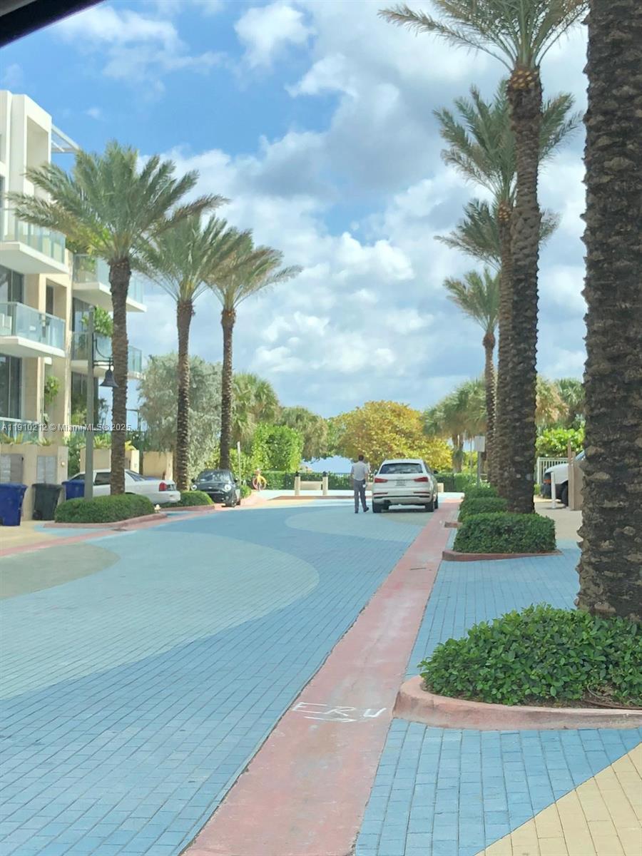 9499 Collins Avenue, Unit 308 Surfside, FL 33154 - Photo 7 of 8 a view of a city street from a balcony