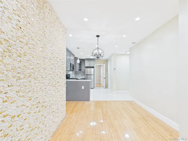 a view of a kitchen with a sink and cabinets