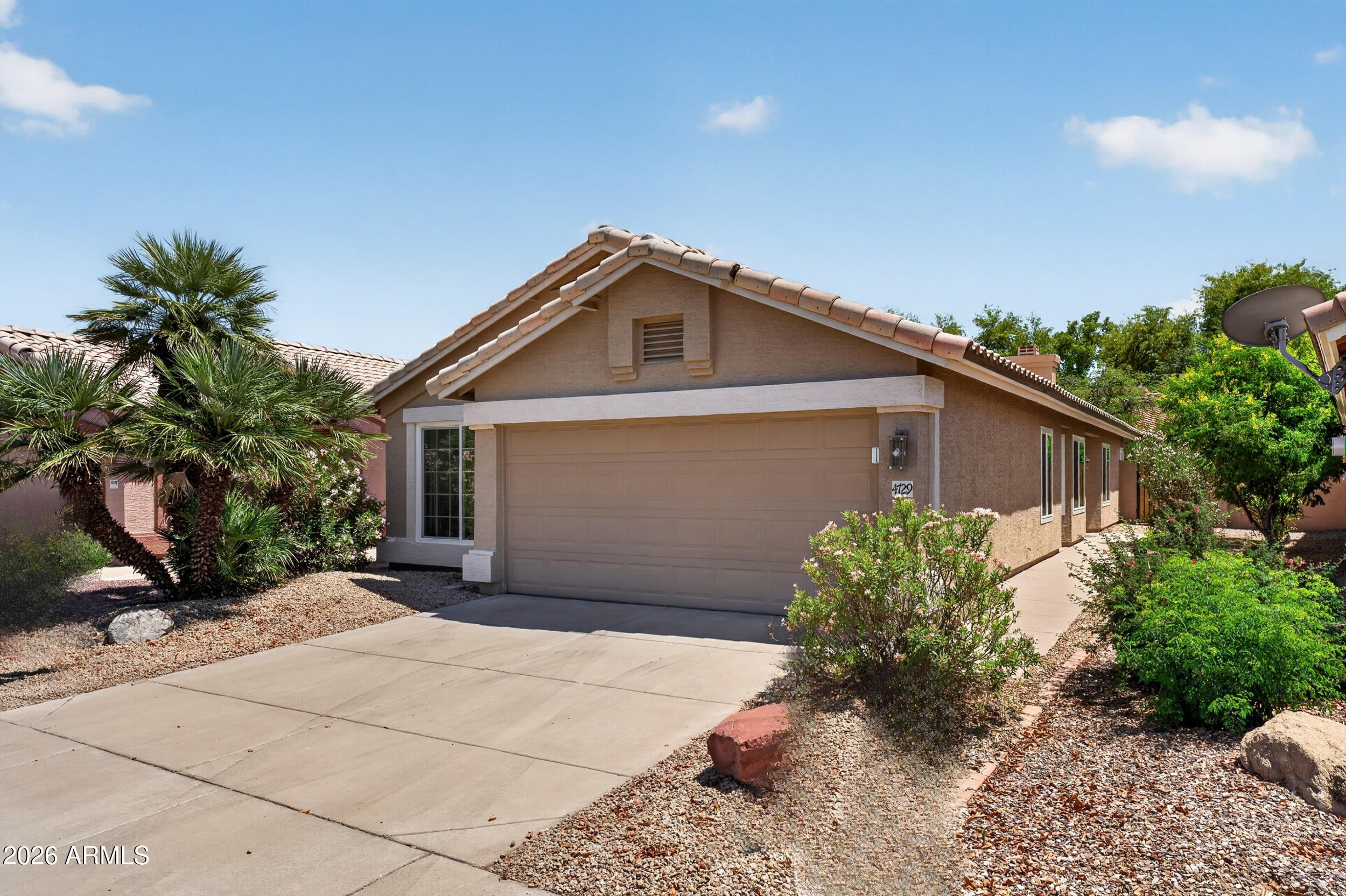4729 West Monterey Street Chandler, AZ 85226 - Photo 35 of 50 a front view of a house with garden