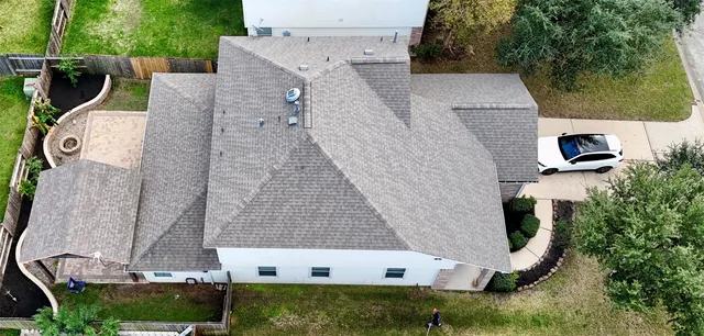 a aerial view of a house with a yard
