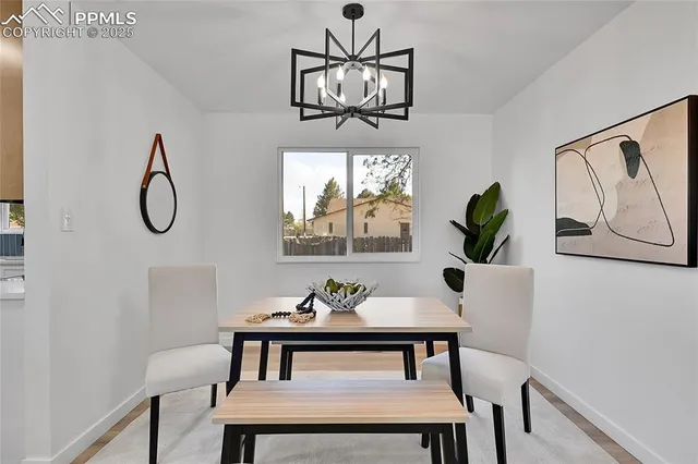 a view of a dining room with furniture window and outside view