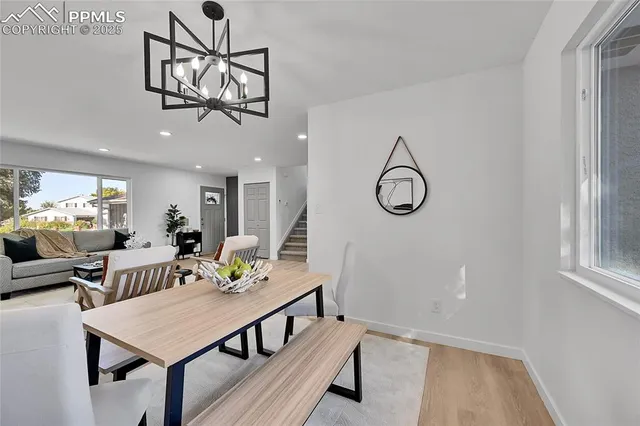 a view of a room with furniture and window