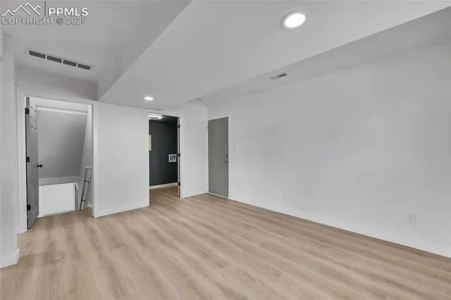 a view of an empty room with a window