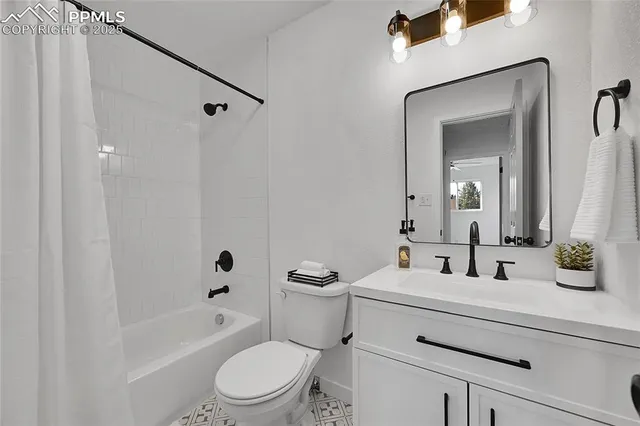 a bathroom with a toilet a sink and a bathtub