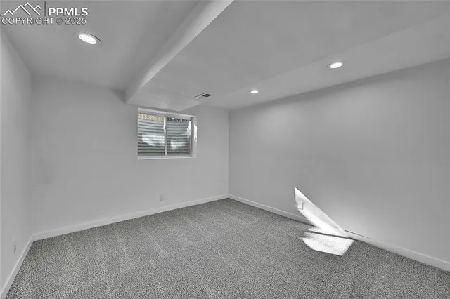 a view of a big room with windows