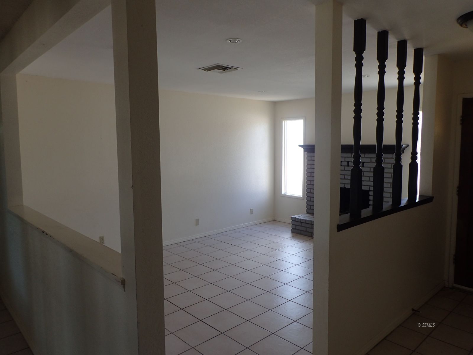 3612 Alene Avenue Ridgecrest, CA 93555 - Photo 3 of 17 a view of a hallway with wooden floor and a bathroom