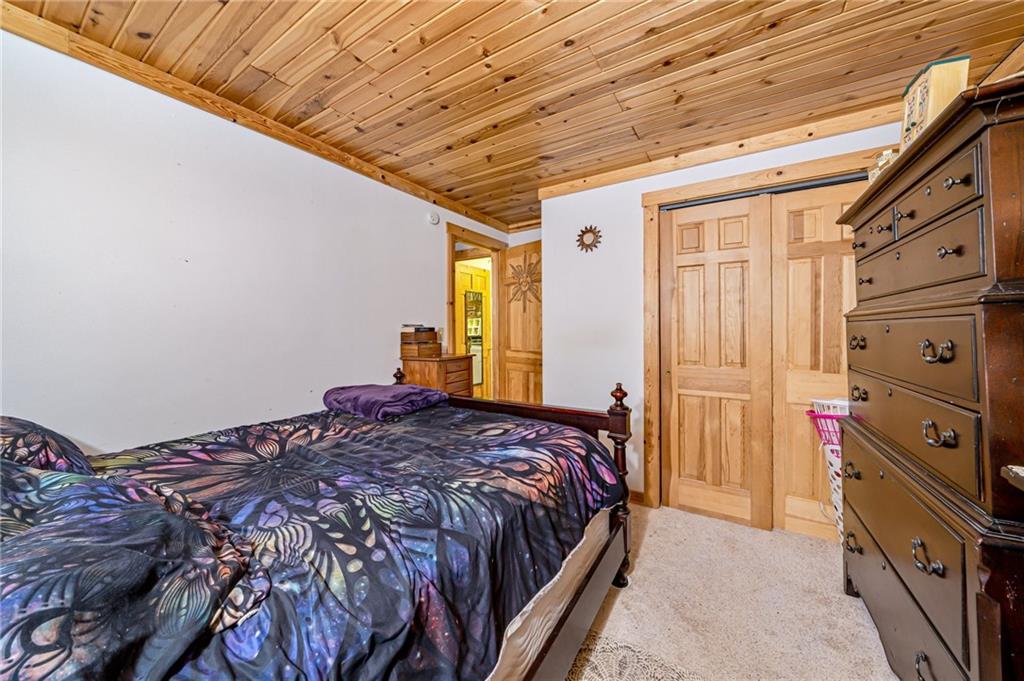 183 Chestnut Ridge Road Acme, PA 15610 - Photo 14 of 29 a bedroom with a bed and a dresser