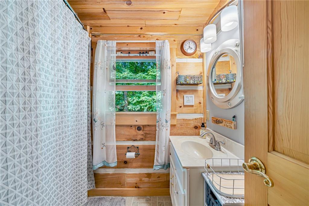 183 Chestnut Ridge Road Acme, PA 15610 - Photo 20 of 29 a bathroom with a sink and a mirror