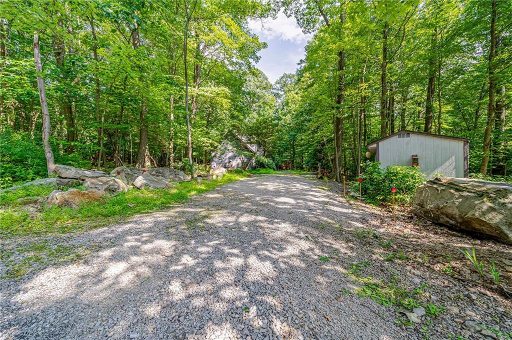 183 Chestnut Ridge Road Acme, PA 15610 - Photo 24 of 29 a backyard of a house with lots of green space