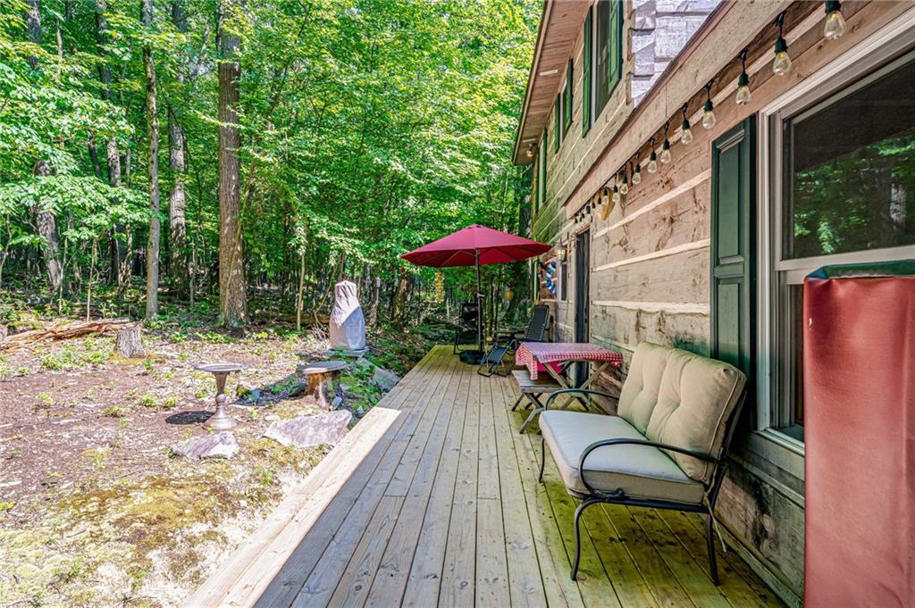 183 Chestnut Ridge Road Acme, PA 15610 - Photo 25 of 29 a backyard of a house with table and chairs
