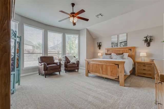 a bedroom with furniture and window