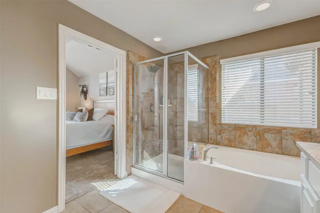 a en suite spacious bathroom with a shower and a bathtub