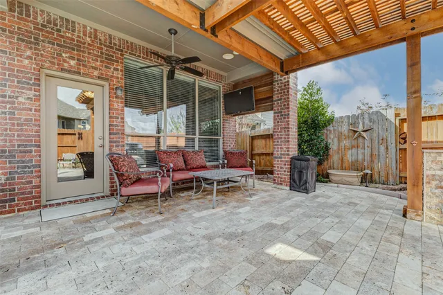a view of a two chairs in a patio