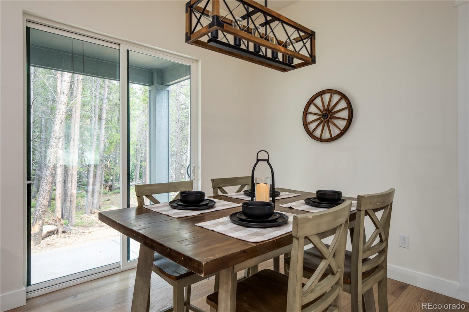 146 Elk Road Idaho Springs, CO 80452 - Photo 7 of 15 a view of a table and chairs in the floor