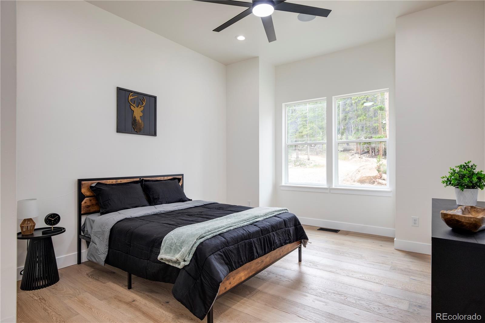 146 Elk Road Idaho Springs, CO 80452 - Photo 8 of 15 a bedroom with a bed and window