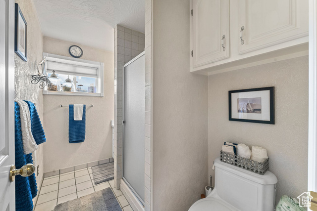 6407 North Dry Frk Cyn Road West Vernal, UT 84078 - Photo 41 of 48 Full bath featuring toilet, a shower stall, and tile patterned flooring